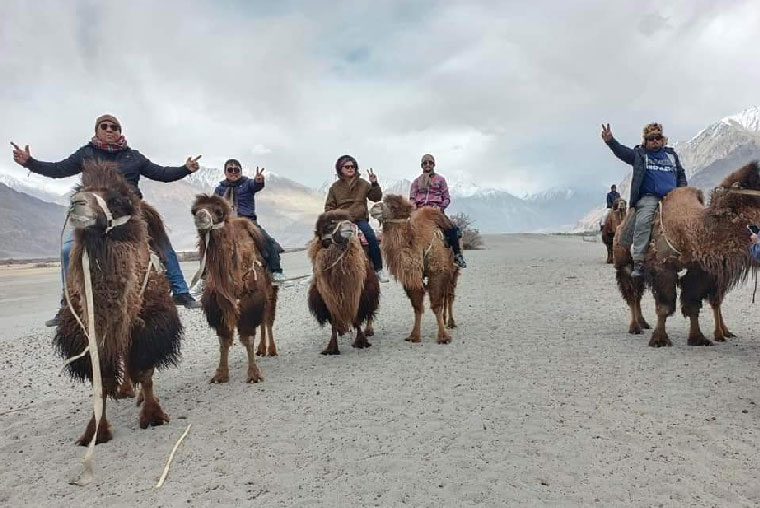 Happy Vacation - Guest from Ranchi enjoying Yak Ride at Tsomgo Lake Sikkim, Popular Tourist Spot in Sikkim to visit, Yak Safari in Sikkim, Yak Ride is a very popular tourist attraction of Tsomgo Lake, Best Travel Agent for Sikkim Northeast India